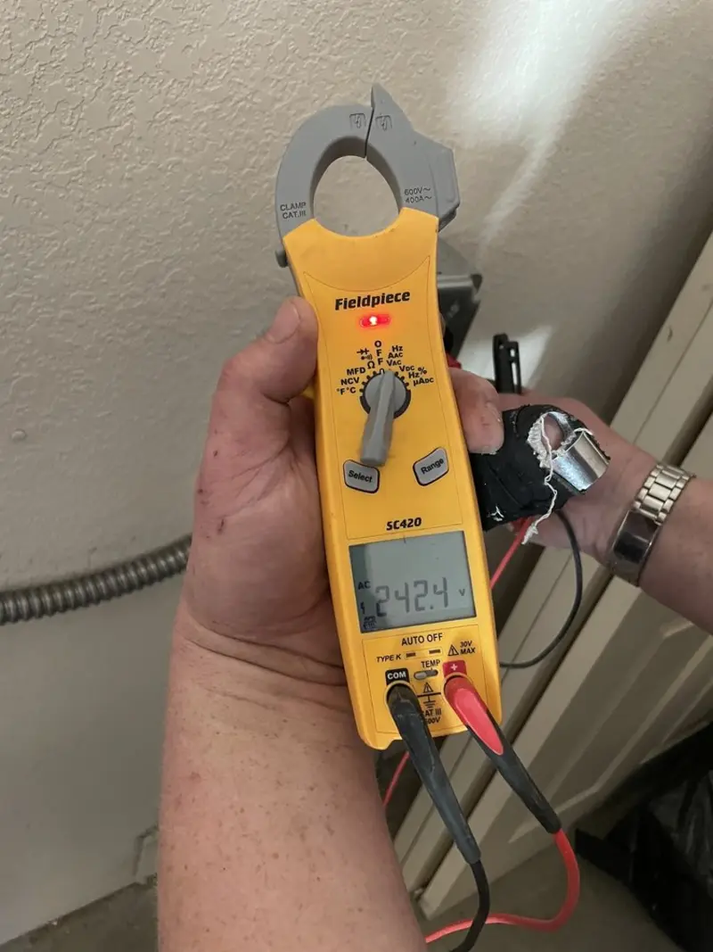 Voltage testing with clamp meter during Electrical Installation Services in Tahlequah